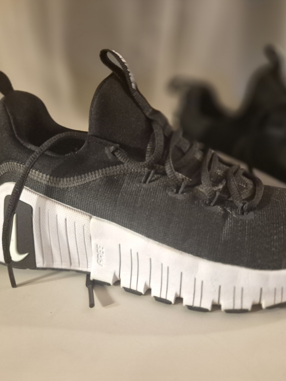 Women's Nike Black and White Slip-On Athletic Sneakers